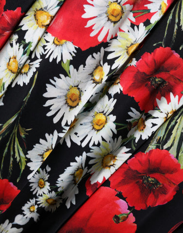 Black floral silk sleeveless long gown dress by Dolce & Gabbana, featuring elegant design and intricate floral pattern.