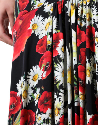 Black floral silk sleeveless long gown dress by Dolce & Gabbana, featuring a flowing silhouette and elegant floral pattern.