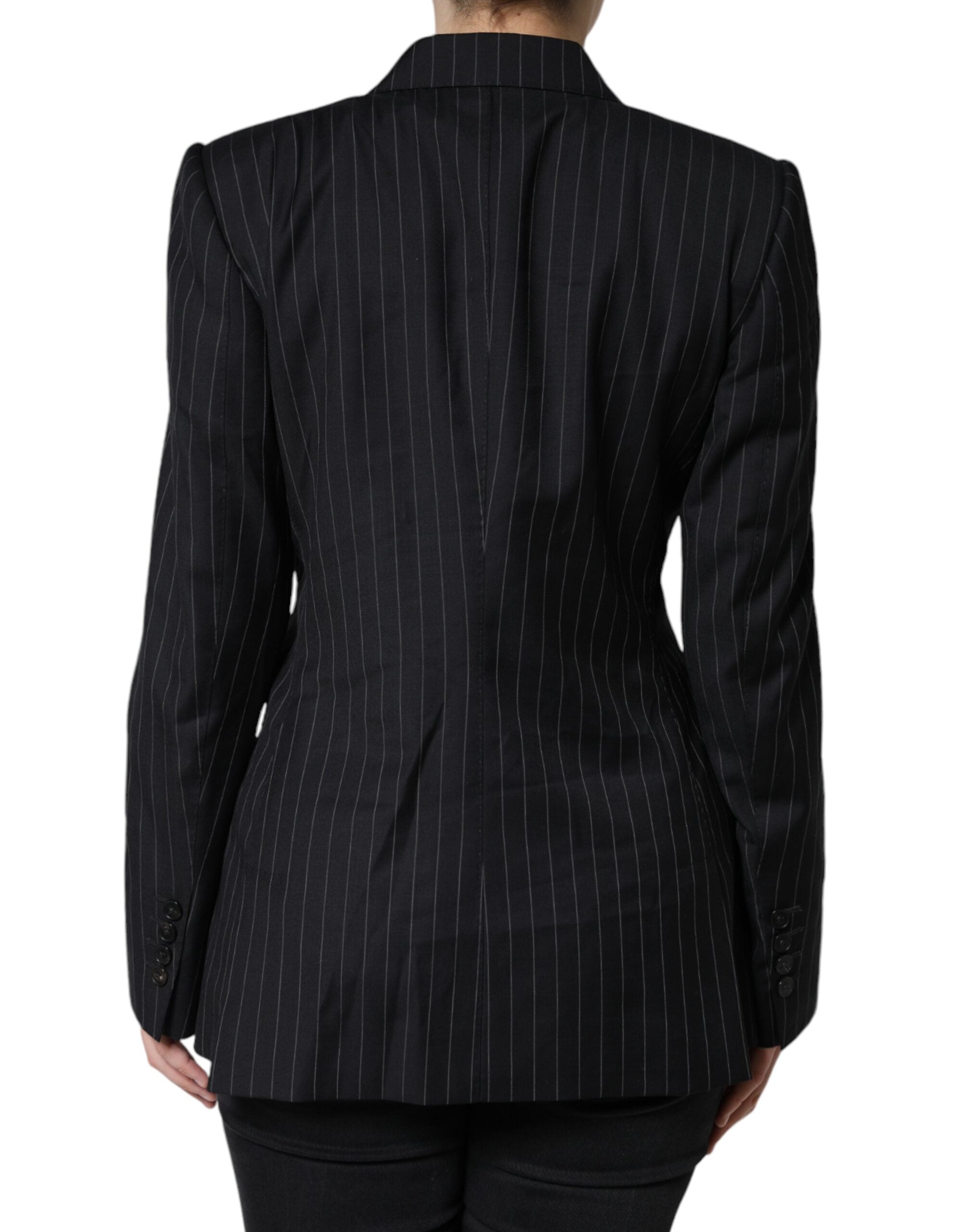 Black striped double-breasted coat jacket by Dolce & Gabbana, shown hanging with front buttons and tailored fit.