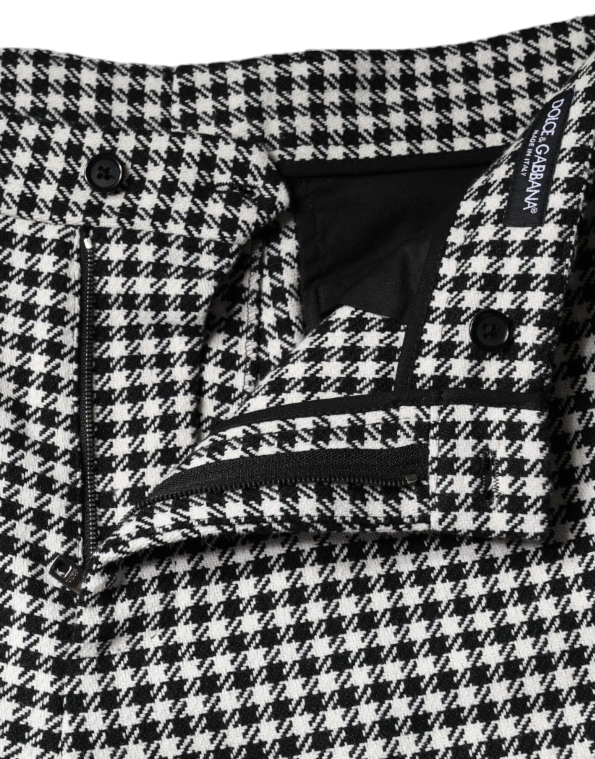 Black and white houndstooth cropped wide-leg pants by Dolce & Gabbana, displayed on a model.