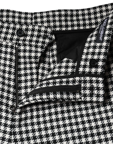 Black and white houndstooth cropped wide-leg pants by Dolce & Gabbana, displayed on a model.