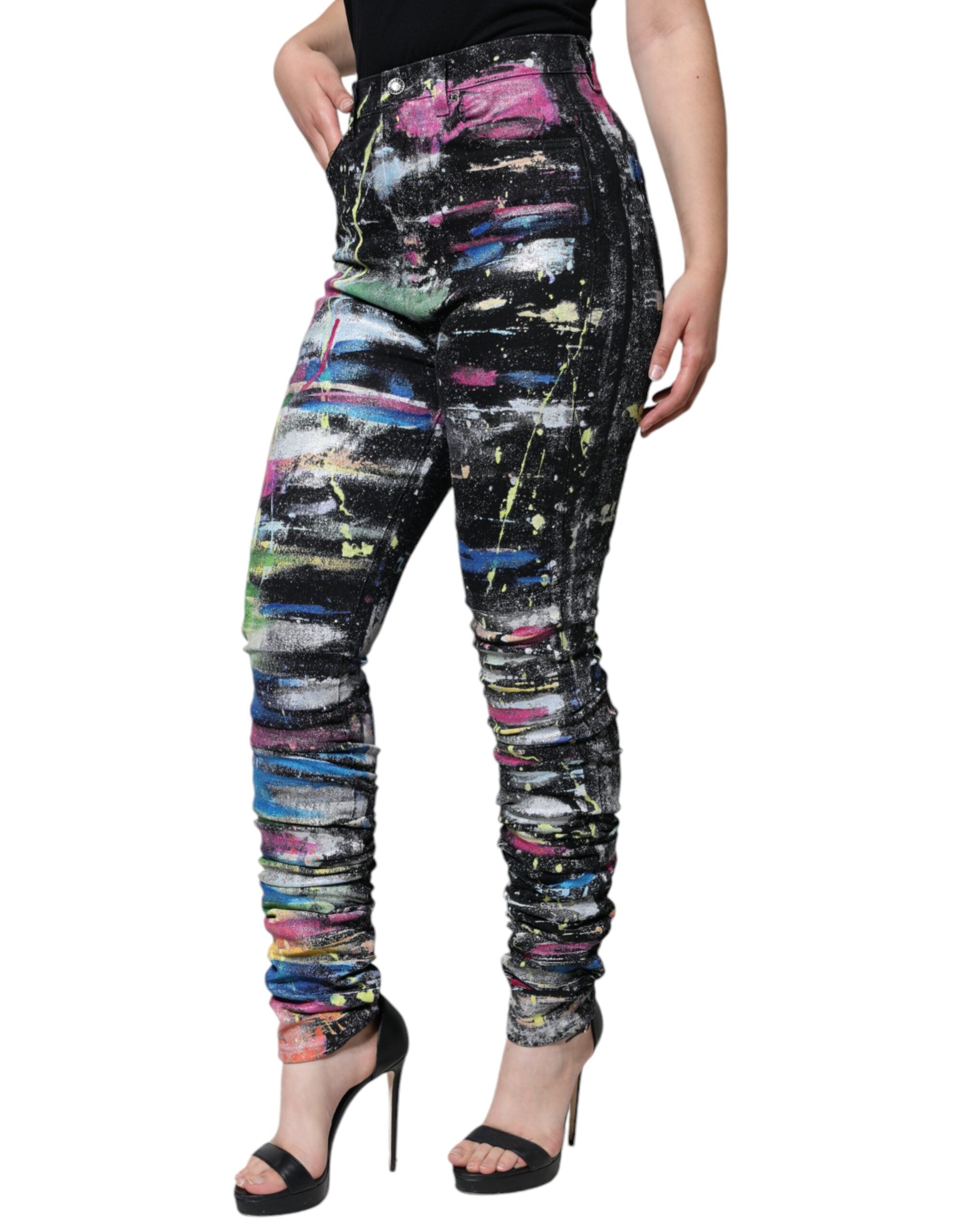 Multicolor splatter paint cotton skinny denim jeans by Dolce & Gabbana showing vibrant paint splashes and slim fit design.