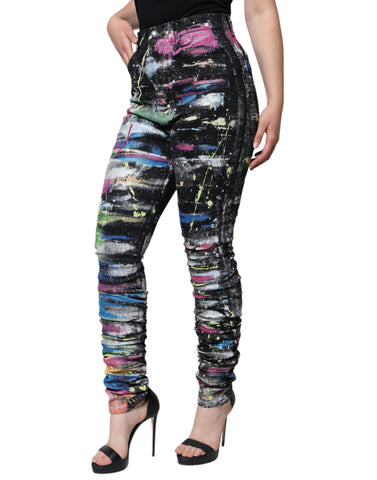 Multicolor splatter paint cotton skinny denim jeans by Dolce & Gabbana showing vibrant paint splashes and slim fit design.