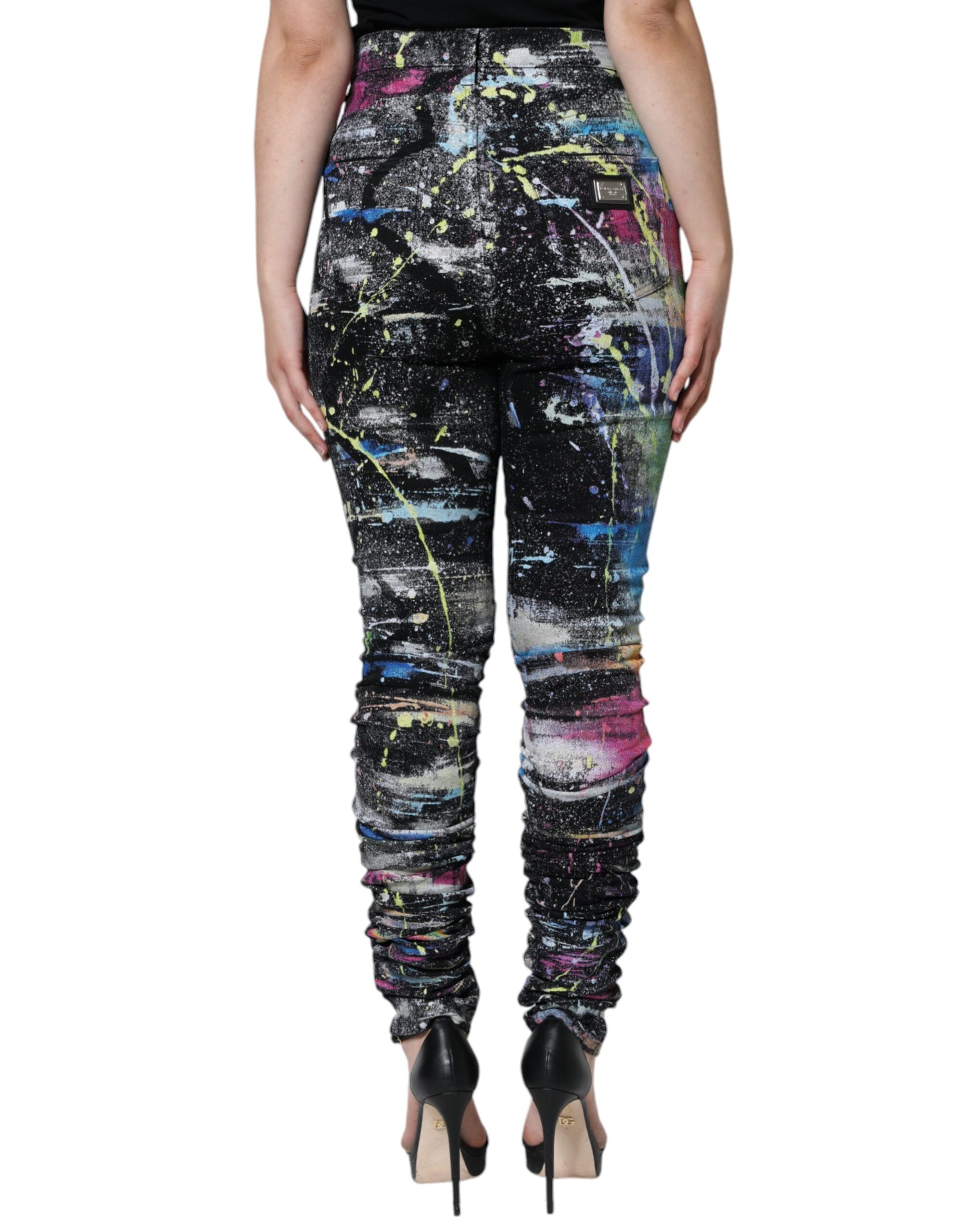 Multicolor splatter paint cotton skinny denim jeans by Dolce & Gabbana, showing vibrant design and fitted silhouette.