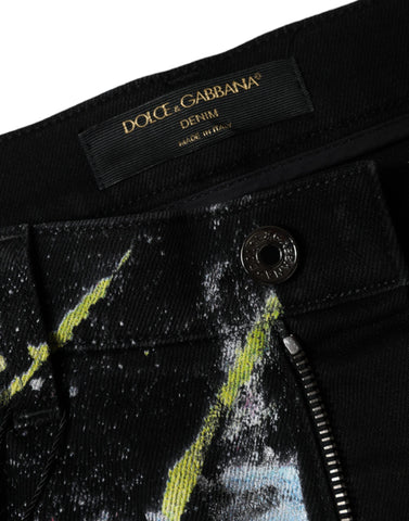 Multicolor splatter paint cotton skinny denim jeans by Dolce & Gabbana, showing vibrant paint splashes on classic blue denim.