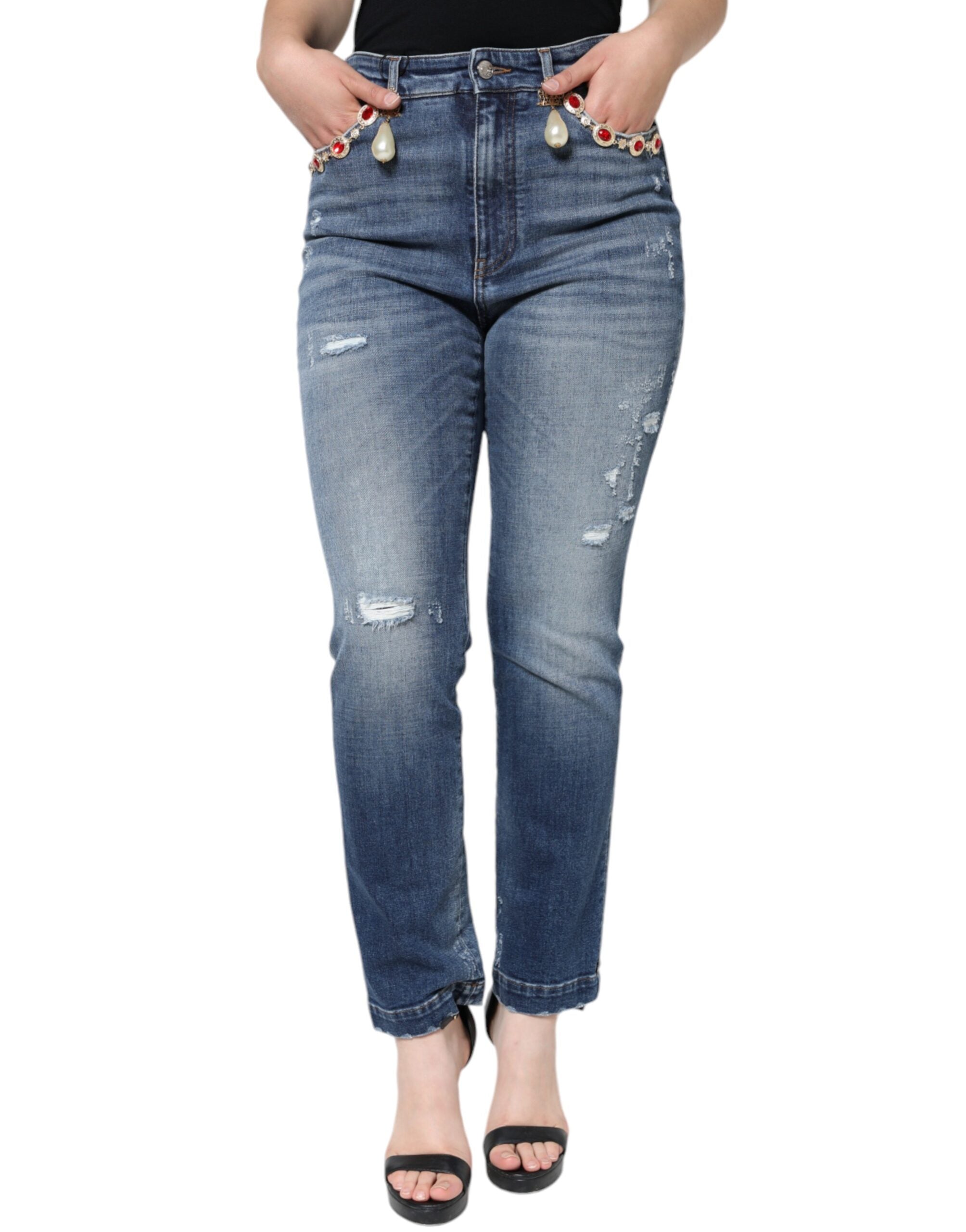 Dark blue cotton tattered skinny denim jeans by Dolce & Gabbana displayed on a model.