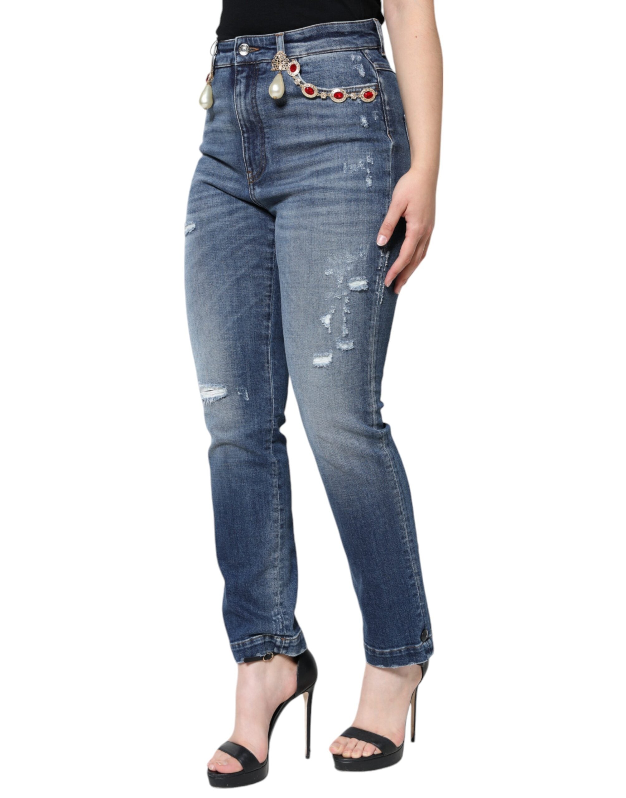 Dark blue cotton tattered skinny denim jeans by Dolce & Gabbana, showcasing distressed details and slim fit silhouette.