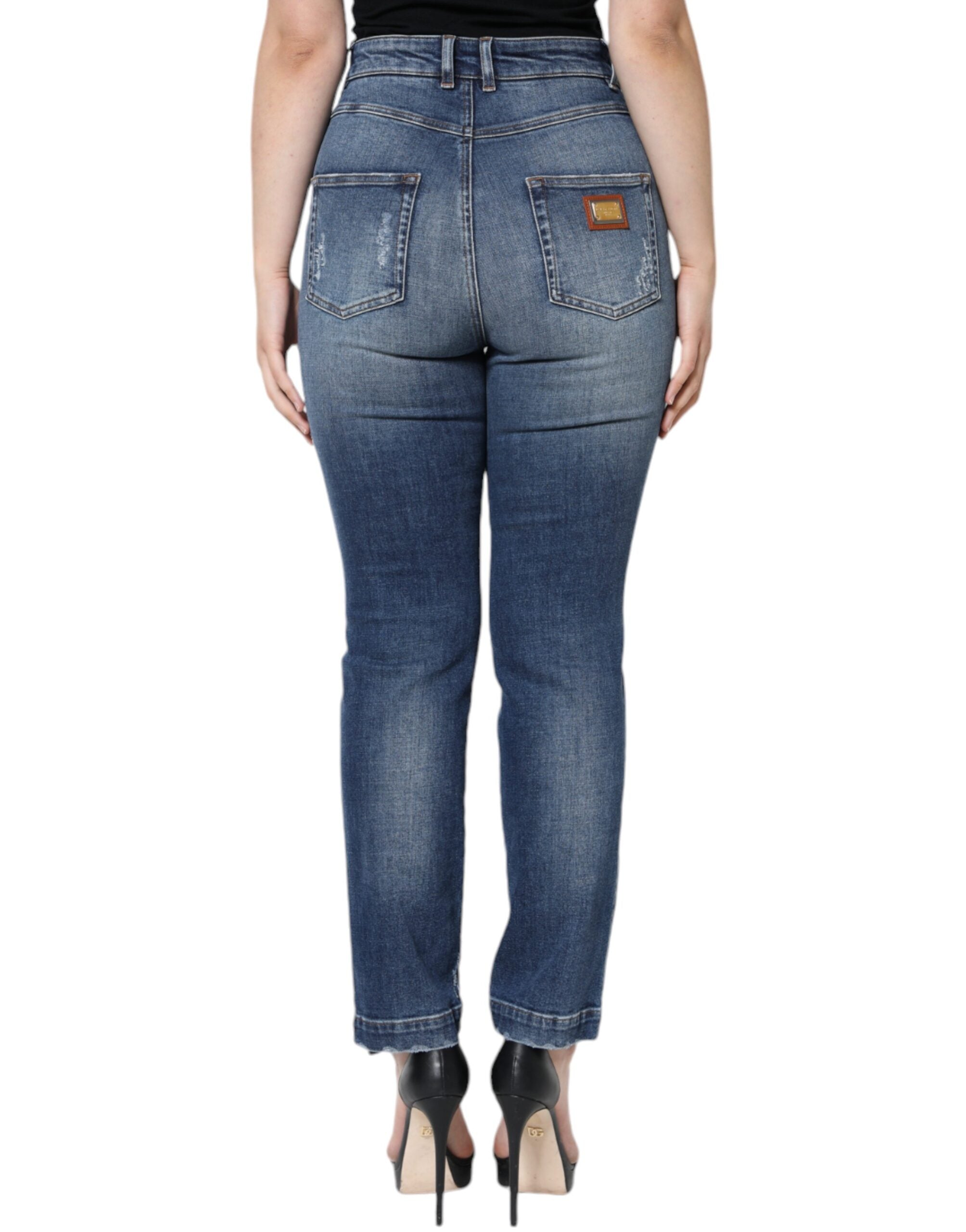 Dark blue cotton tattered skinny denim jeans by Dolce & Gabbana with distressed details and a fitted silhouette.