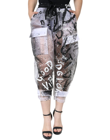 White see-through logo cropped cargo pants by Dolce & Gabbana, featuring transparent fabric and stylish cargo pockets.