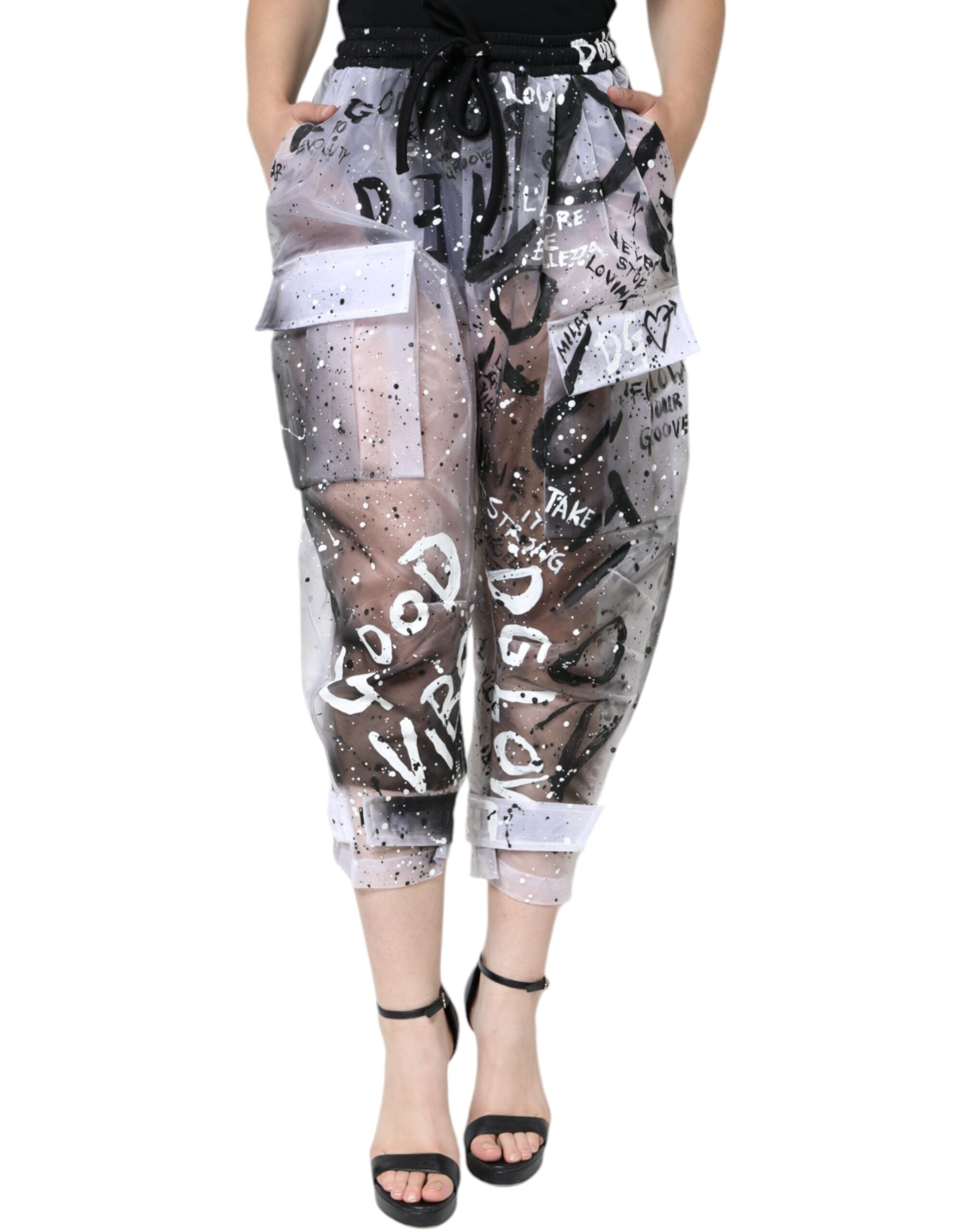 White see-through logo cropped cargo pants by Dolce & Gabbana, featuring transparent fabric and cargo pocket details.
