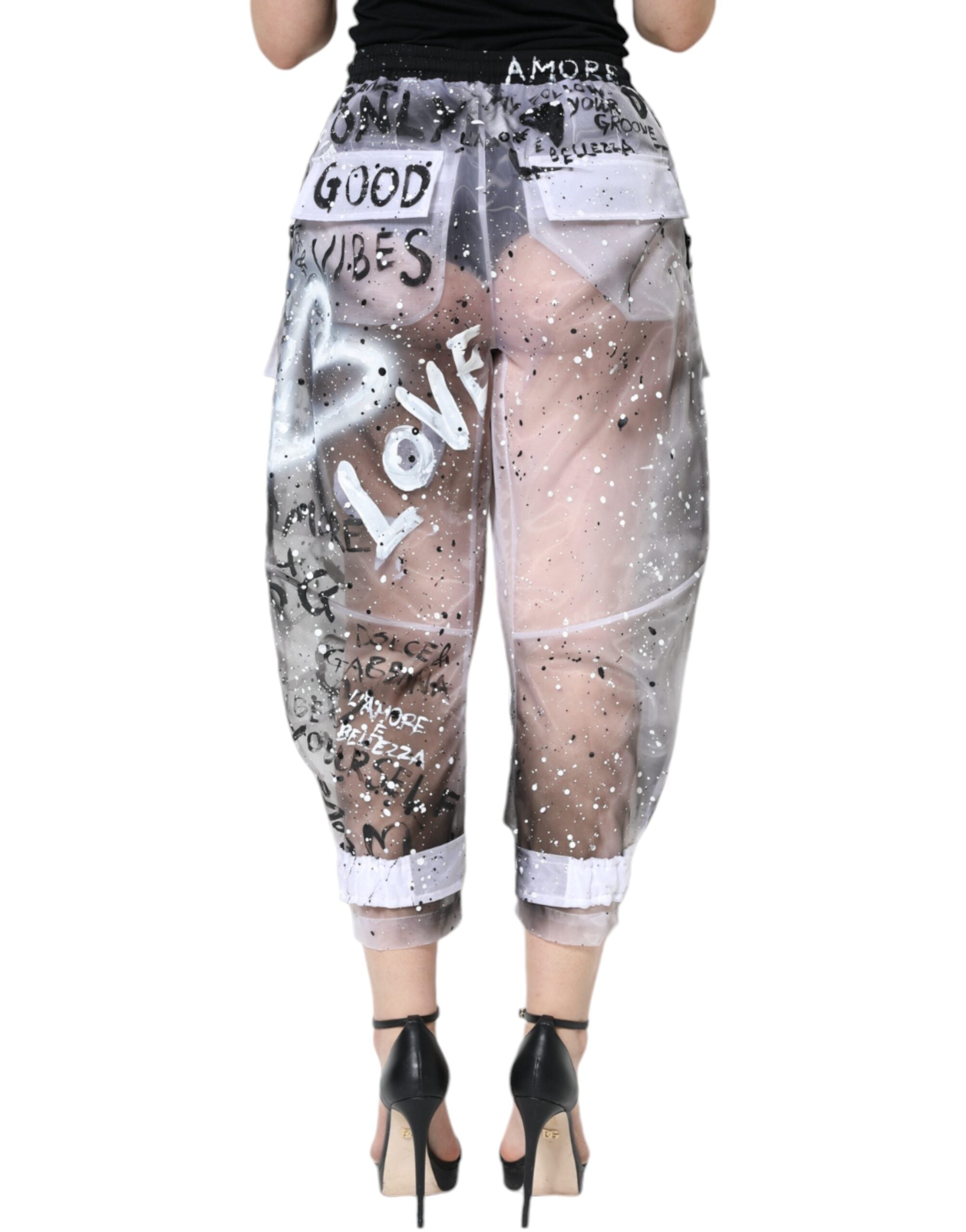 White see-through logo cropped cargo pants by Dolce & Gabbana with visible cargo pockets and transparent fabric details.