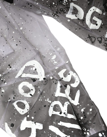 White see-through logo cropped cargo pants by Dolce & Gabbana, featuring sheer fabric and stylish cargo pockets.