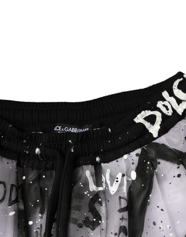 White see-through logo cropped cargo pants by Dolce & Gabbana with transparent fabric and cargo pockets.