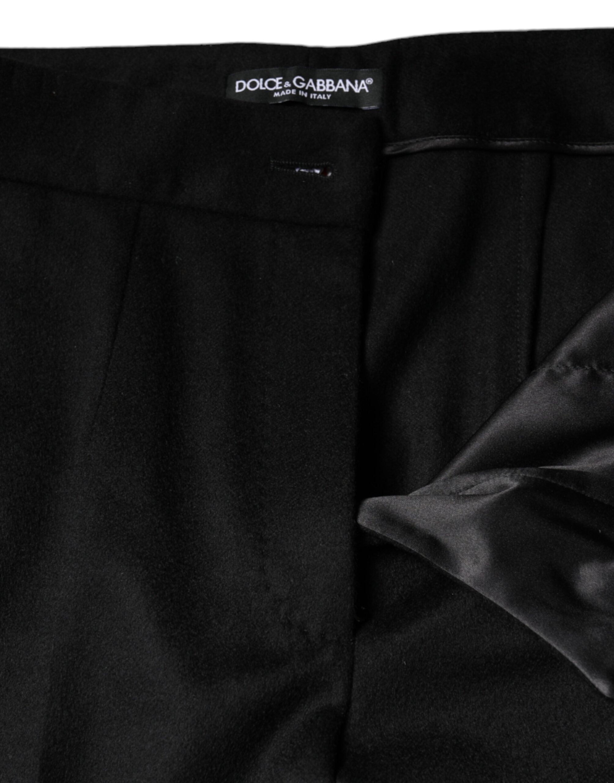 Black cashmere mid-waist boot cut pants for women by Dolce & Gabbana, showing a close-up of the fabric and fit.