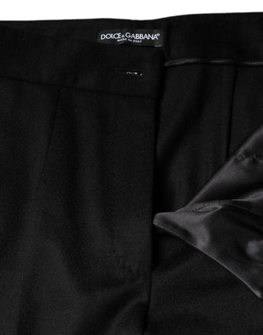Black cashmere mid-waist boot cut pants for women by Dolce & Gabbana, showing a close-up of the fabric and fit.