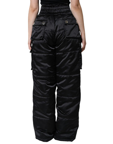Black quilted high waist women’s boot cut pants by Dolce & Gabbana, shown on a model, with detailed quilting and tailored fit.