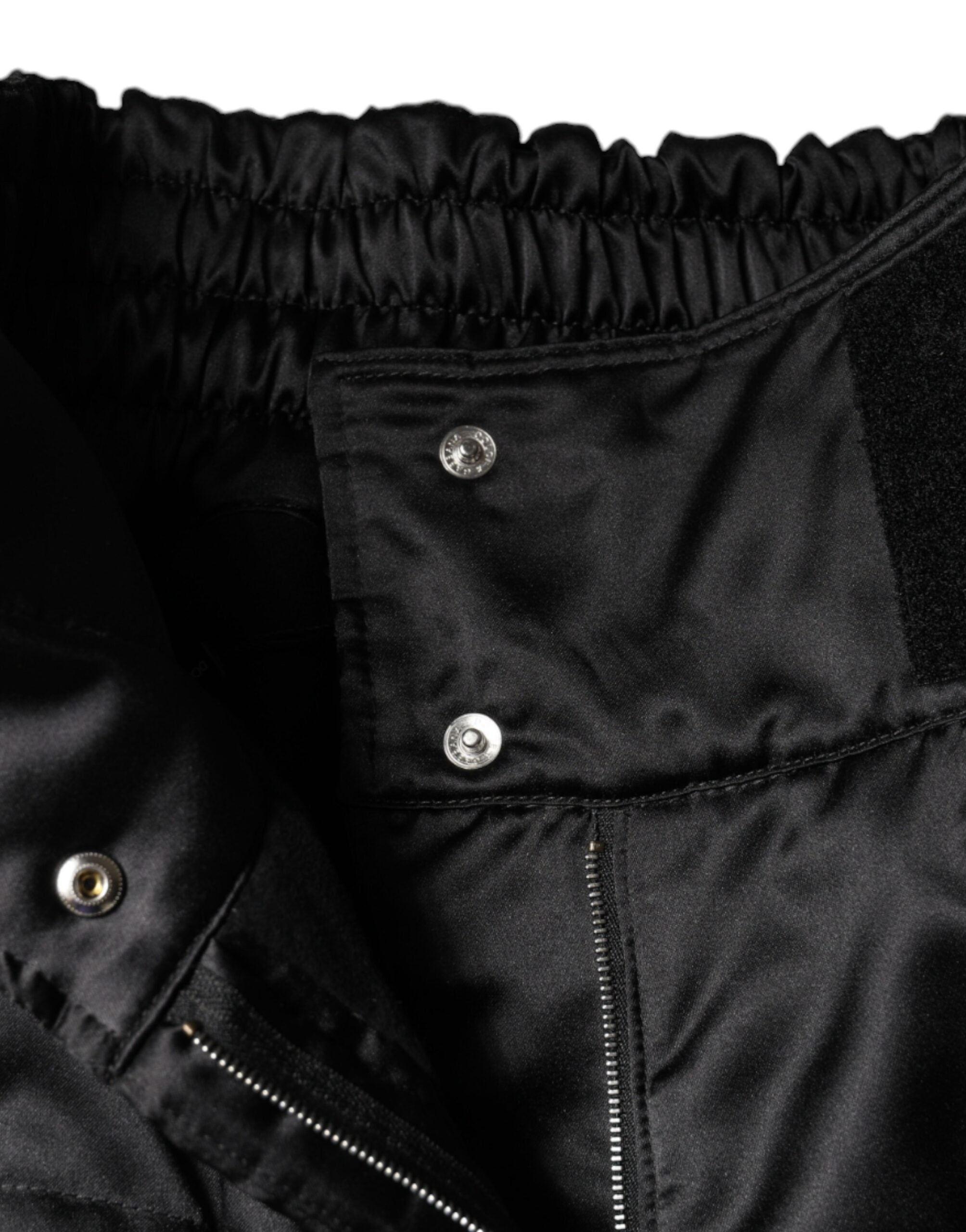 Black quilted high waist women’s boot cut pants by Dolce & Gabbana, featuring a stylish quilted pattern and tailored fit.