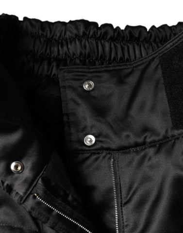Black quilted high waist women’s boot cut pants by Dolce & Gabbana, featuring a stylish quilted pattern and tailored fit.