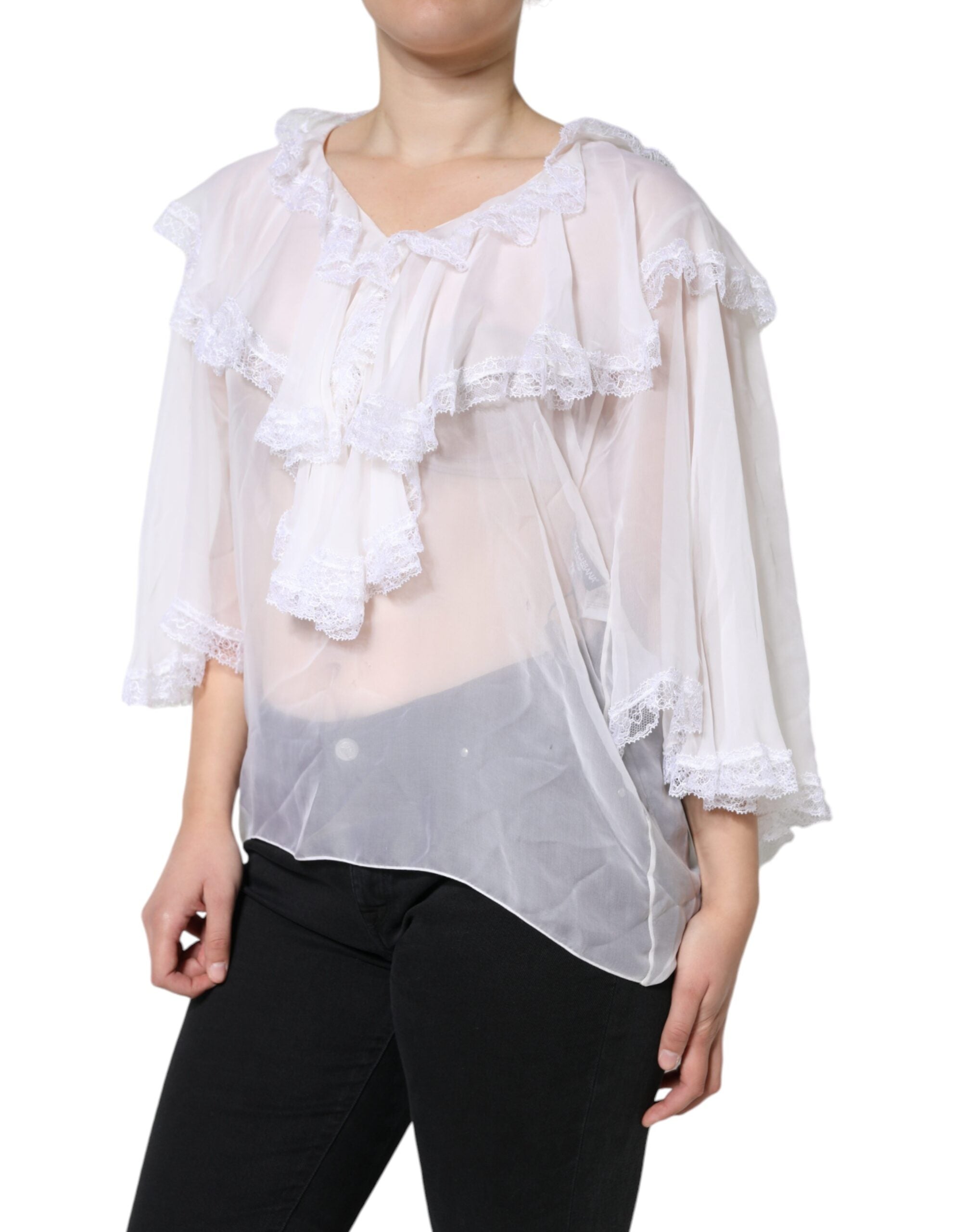 White lace long sleeve blouse with ruffles, from Dolce & Gabbana, featuring intricate detailing and a feminine, elegant design.