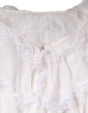 White lace long sleeve blouse with ruffles from Dolce & Gabbana, featuring delicate detailing and elegant design.
