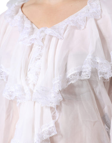 White lace long sleeve blouse with ruffles from Dolce & Gabbana, featuring intricate lace details and a feminine design.
