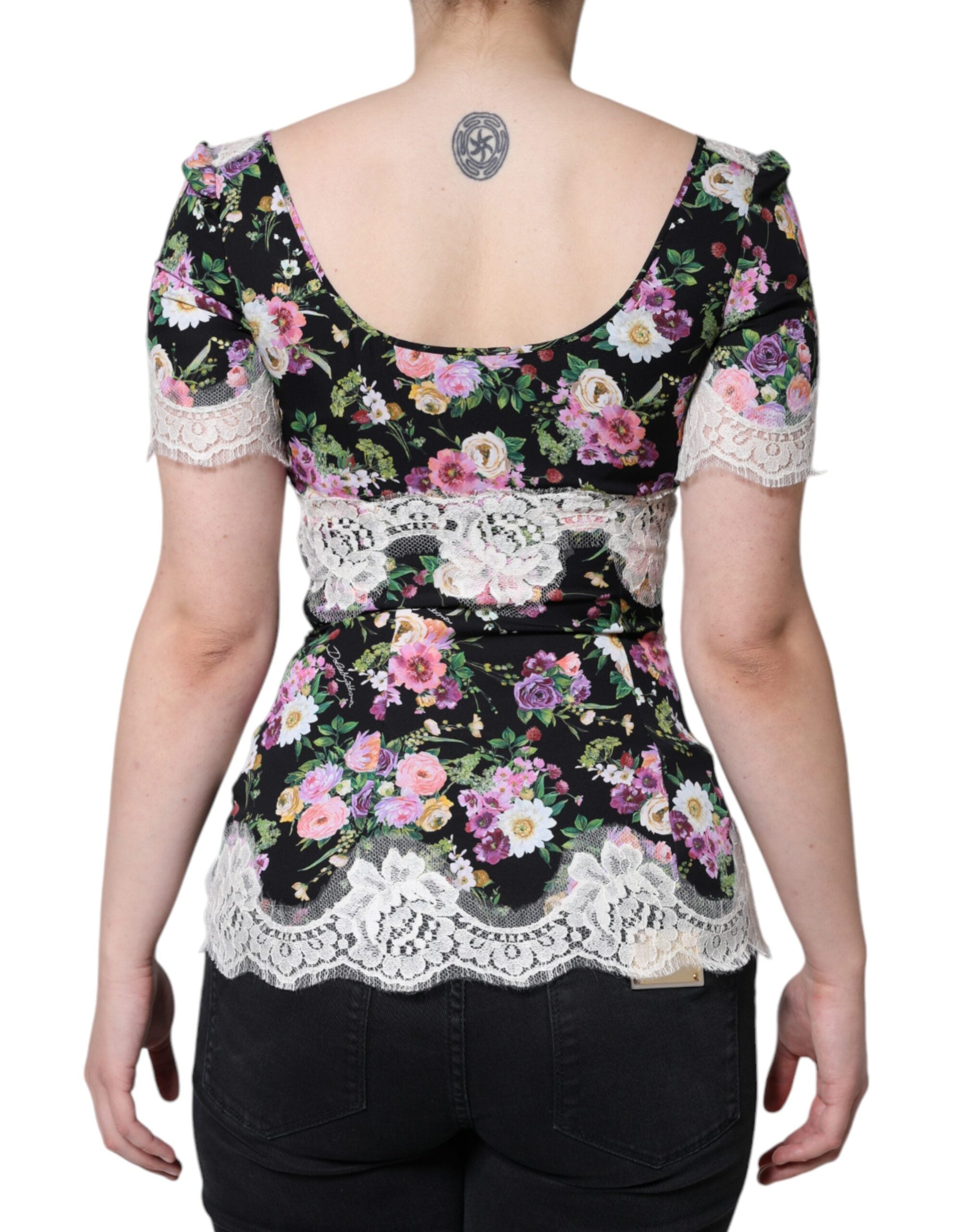 Black floral lace short sleeve blouse top by Dolce & Gabbana featuring intricate lace details and a stylish, feminine design.