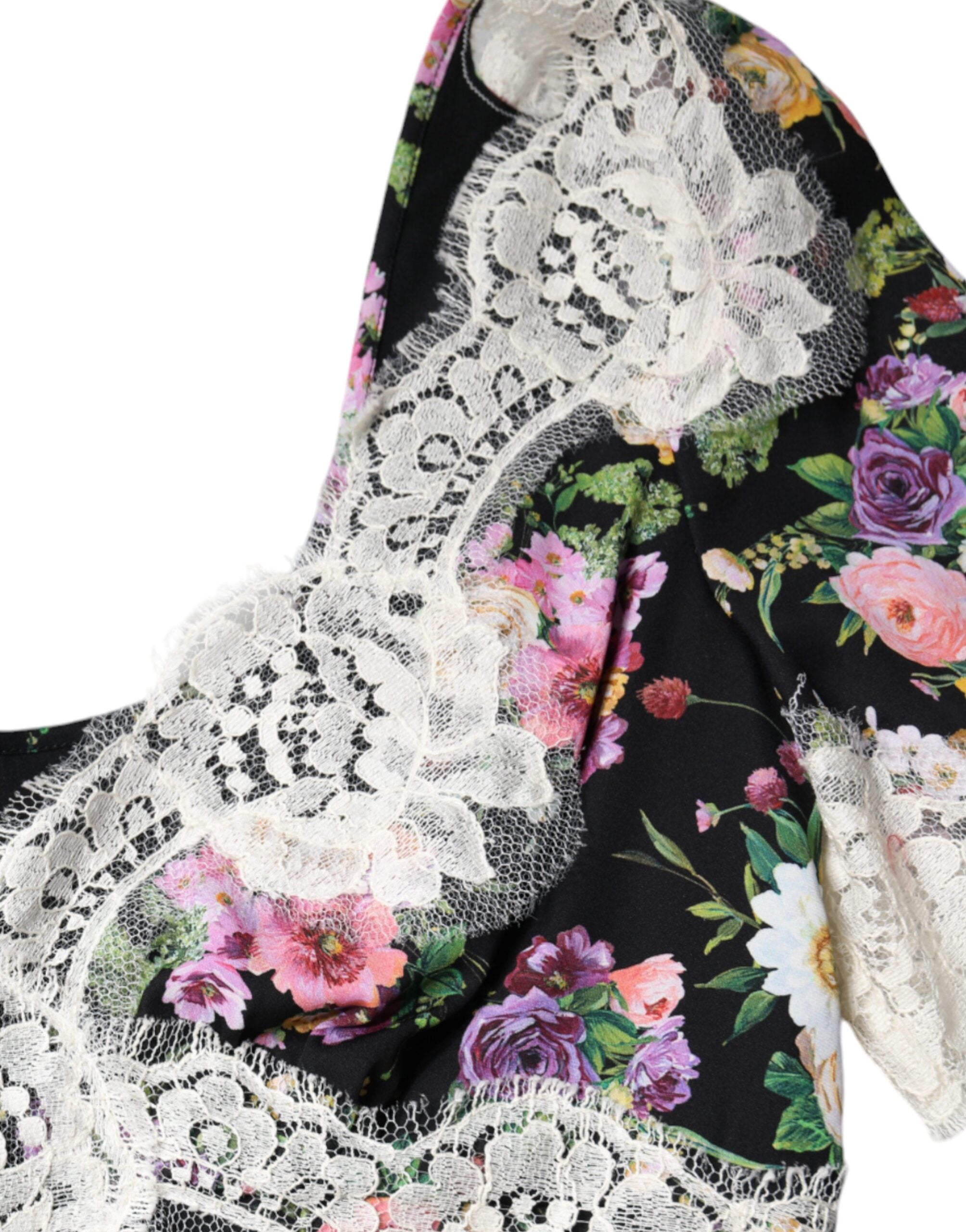 Black floral lace short sleeve blouse top by Dolce & Gabbana, featuring intricate lace details and a elegant, feminine design.