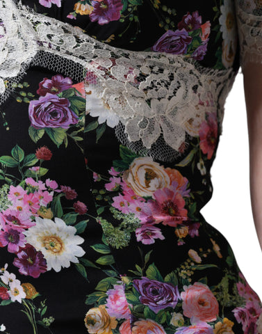 Black floral lace short sleeve blouse top by Dolce & Gabbana with intricate lace detailing and a fitted silhouette.