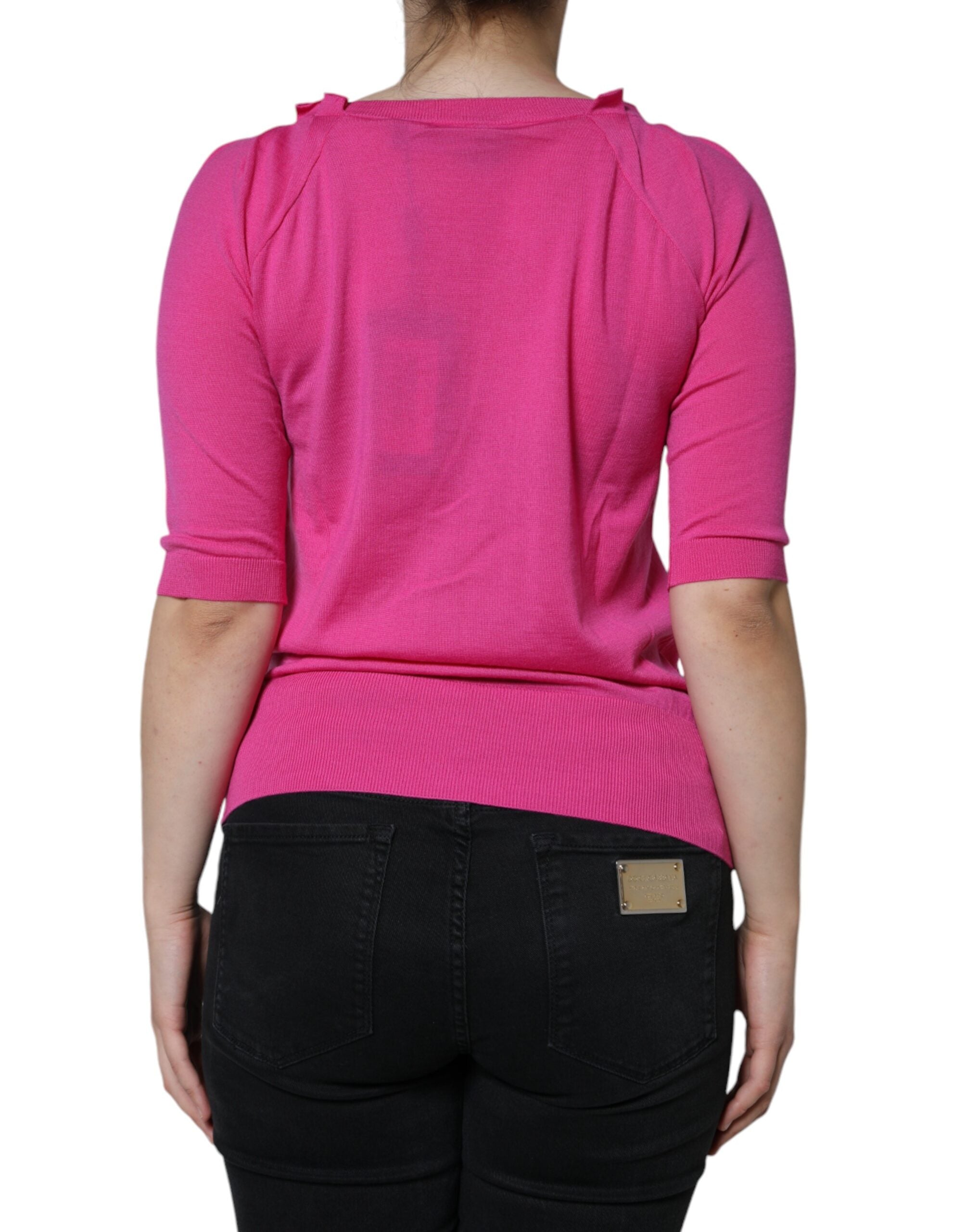 Pink wool button-down short sleeve blouse top by Dolce & Gabbana, featuring a classic collar and button detail.