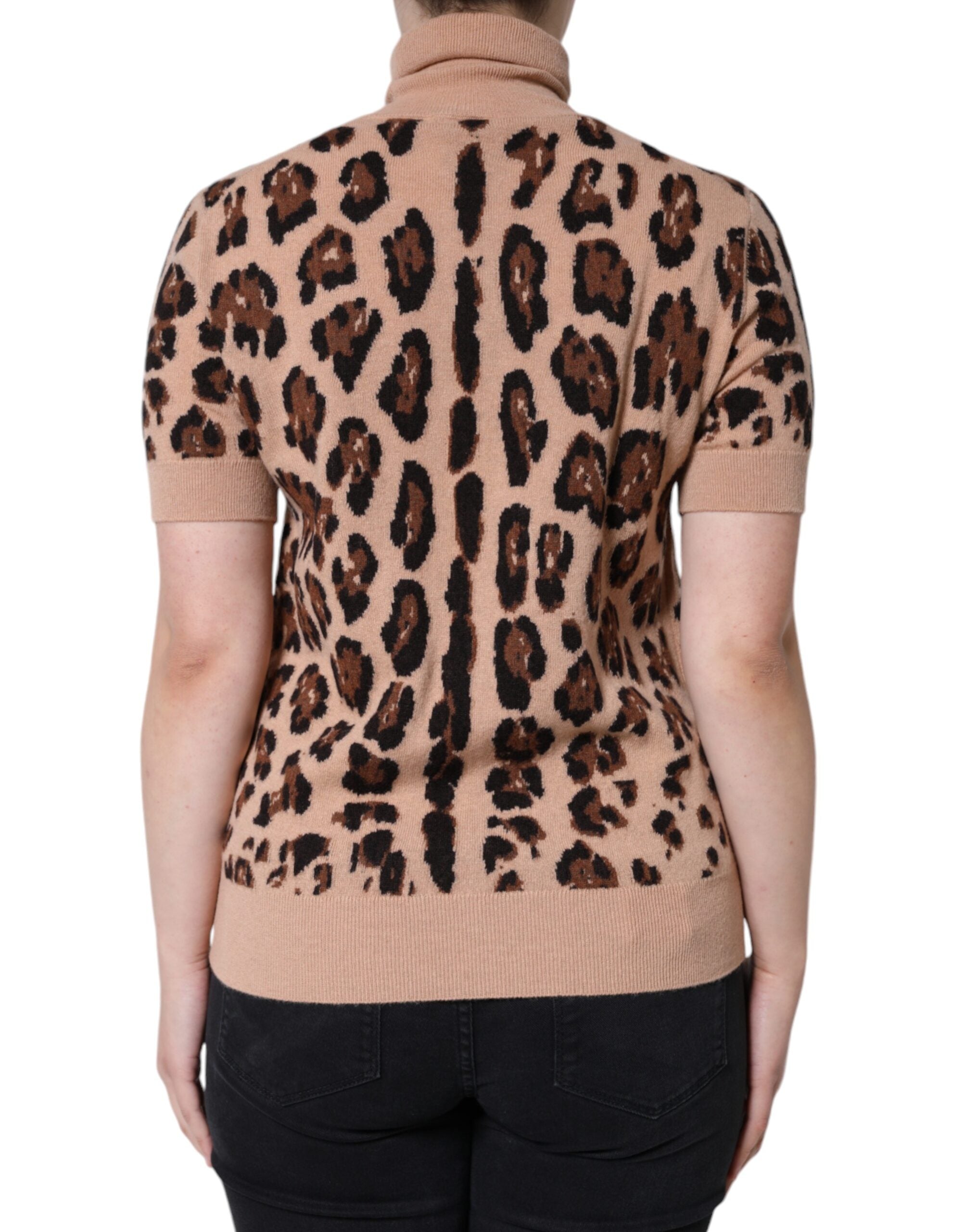 Beige leopard print wool turtleneck top by Dolce & Gabbana, shown on a model with a close-up of the textured fabric and high neckline.