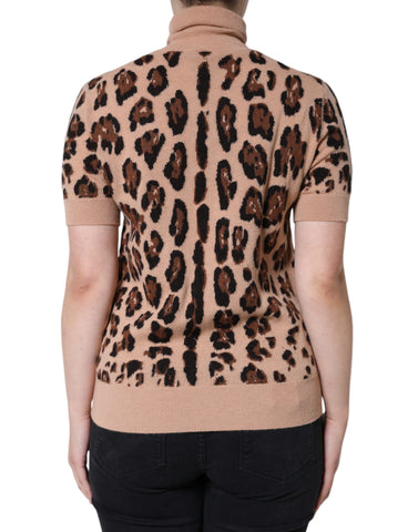 Beige leopard print wool turtleneck top by Dolce & Gabbana, shown on a model with a close-up of the textured fabric and high neckline.