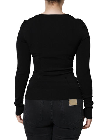 Black long sleeve blouse with square neckline by Dolce & Gabbana, shown on a hanger against a neutral background.