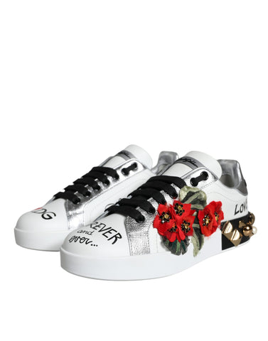 White leather Dolce & Gabbana floral studded sneakers with lace-up design and decorative floral accents.