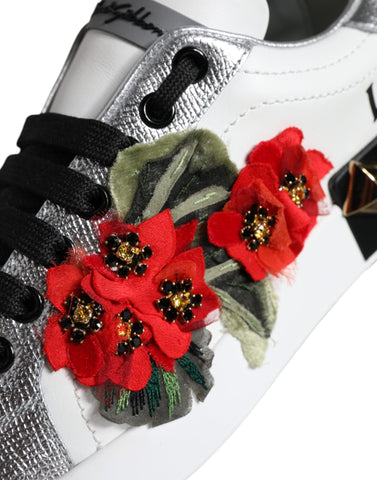 White leather floral studded sneakers by Dolce & Gabbana with decorative flowers and metal studs, casual footwear for women.
