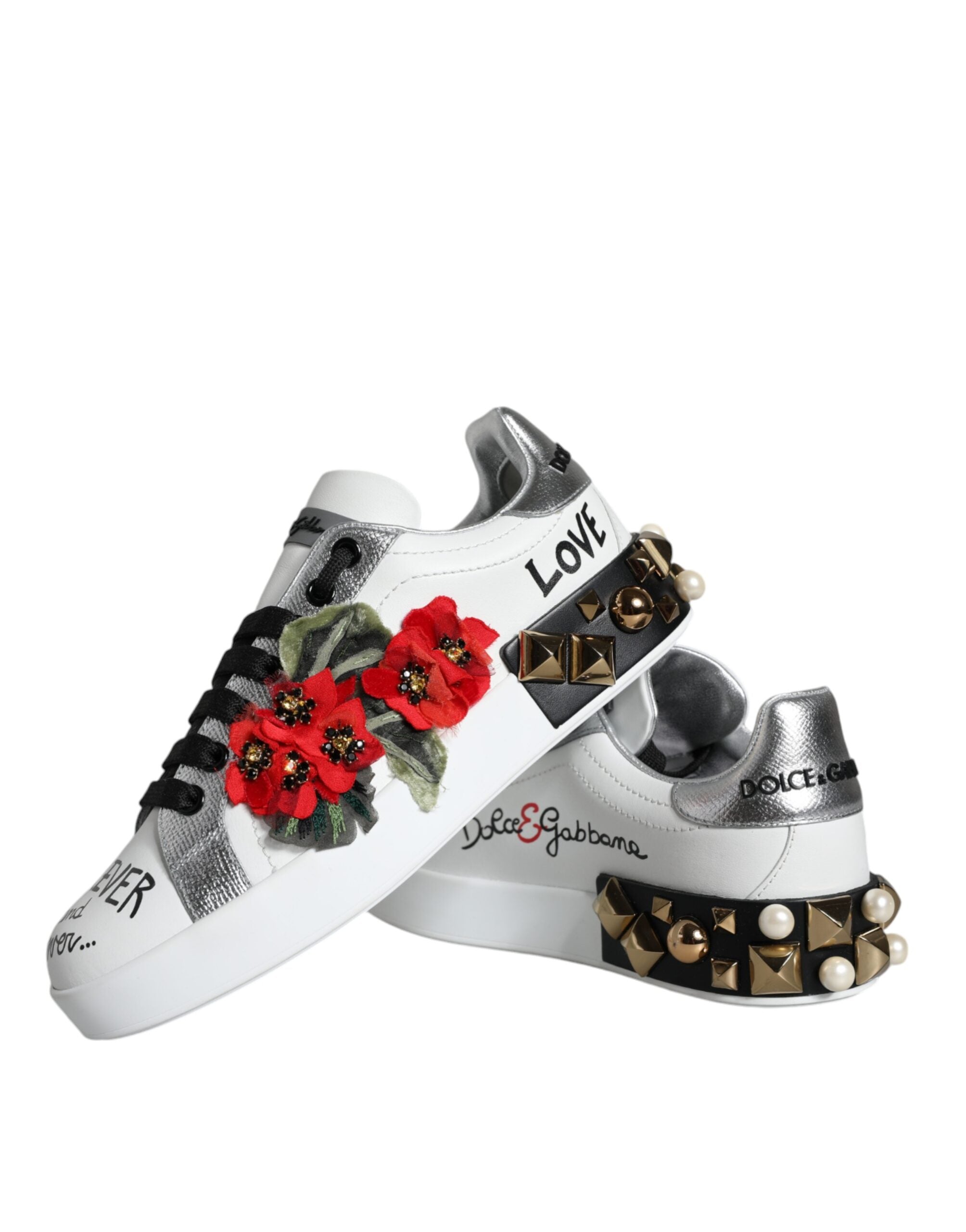 White leather floral studded sneakers by Dolce & Gabbana showing the detailed floral and studded design on the shoes.