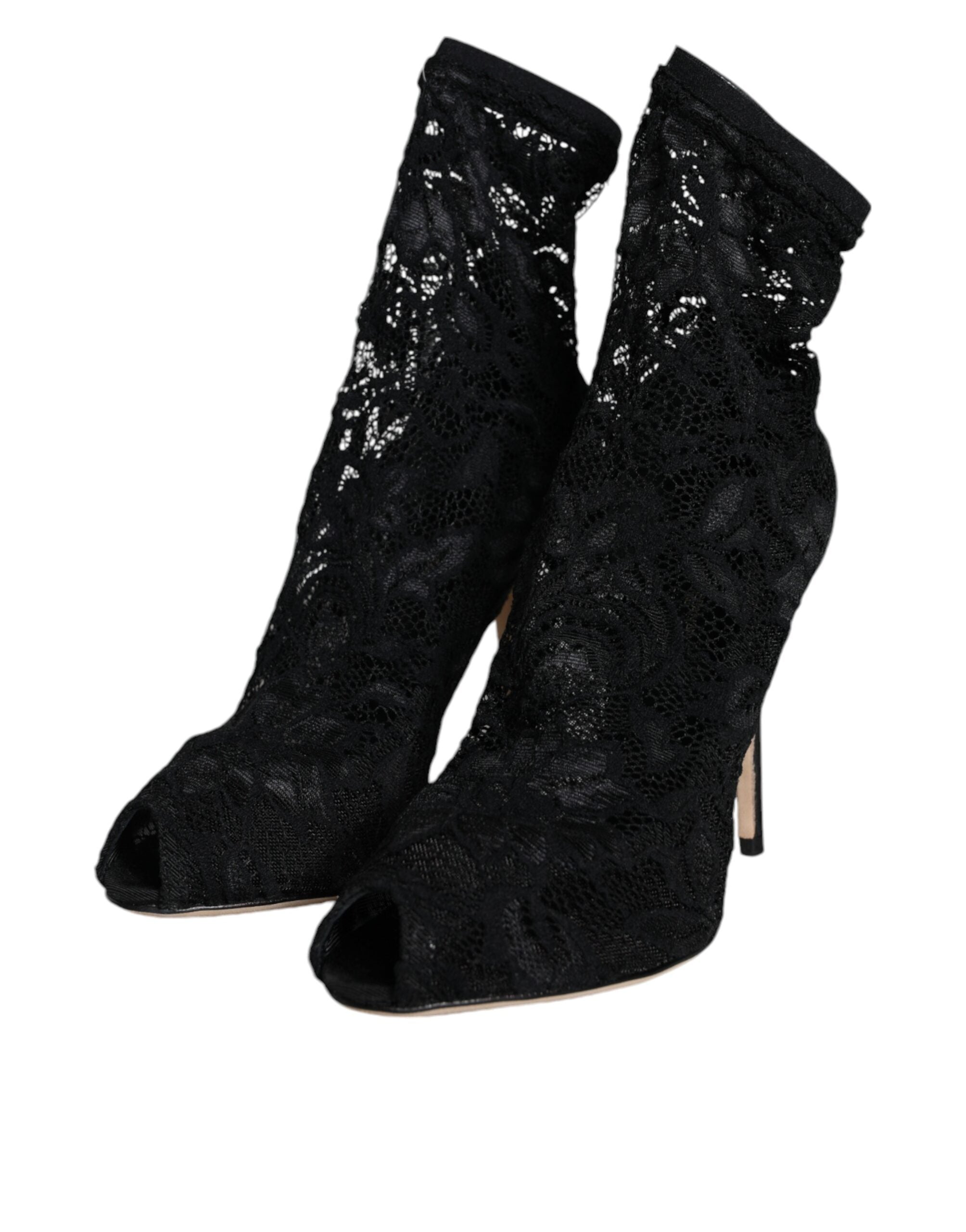 Black lace stretch mid-calf heel boots by Dolce & Gabbana with pointed toes and elegant lace details.