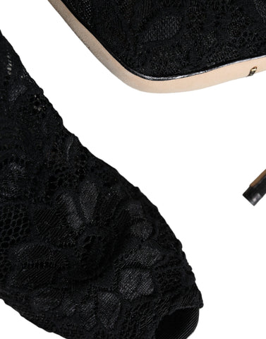 Black lace stretch heel boots with mid-calf length from Dolce & Gabbana, featuring elegant design and strappy details.