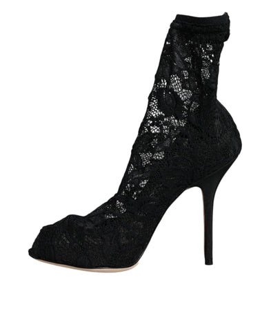 Black lace stretch heel mid calf boot shoes by Dolce & Gabbana with elegant lace detail and sleek high heel design.