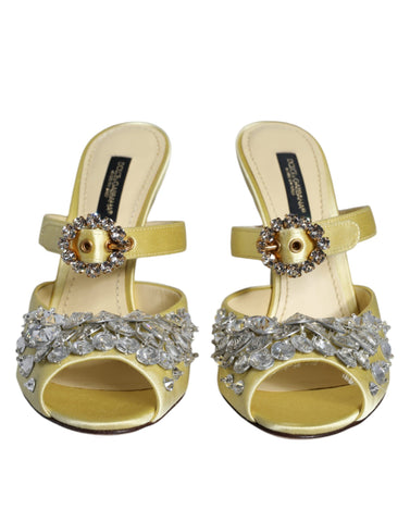 Yellow satin Mary Janes with crystal embellishments from Dolce & Gabbana, featuring a classic shoe design with elegant straps.