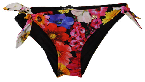 Black floral print Dolce & Gabbana bikini bottom with adjustable side ties, designed for stylish swimwear.