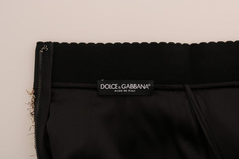 Gold and black Dolce & Gabbana short mini skirt with a sleek, fitted design and stylish pattern.