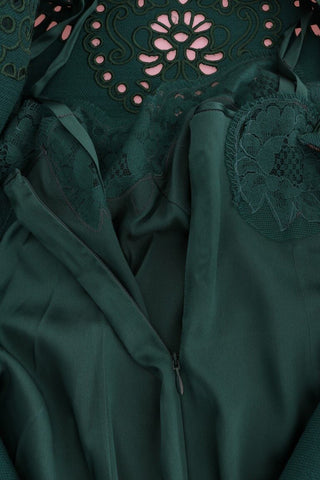 Green floral silk wool dress with cutout details by Dolce & Gabbana, showcasing a stylish, elegant design.