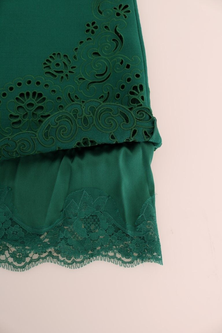 Green floral cutout silk wool dress by Dolce & Gabbana, showing intricate floral patterns and elegant cutout details.