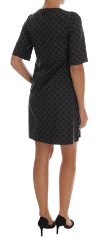 Gray wool stretch dress with polka dots by Dolce & Gabbana, featuring a fitted silhouette and classic pattern.