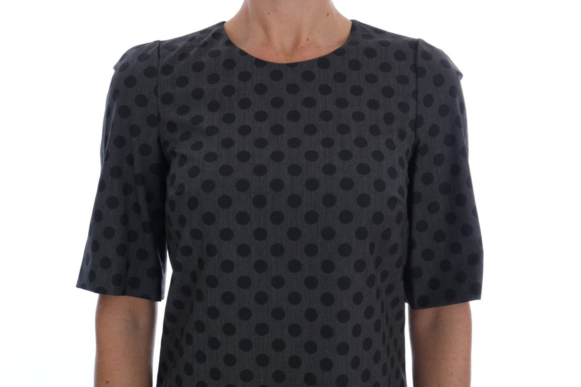 Gray polka dotted wool stretch dress by Dolce & Gabbana, featuring a fitted silhouette and classic pattern.