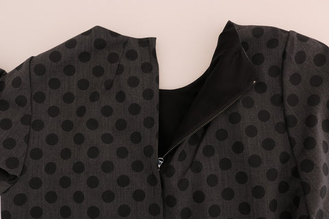 Gray polka dotted wool stretch dress by Dolce & Gabbana, featuring a fitted silhouette and elegant design.