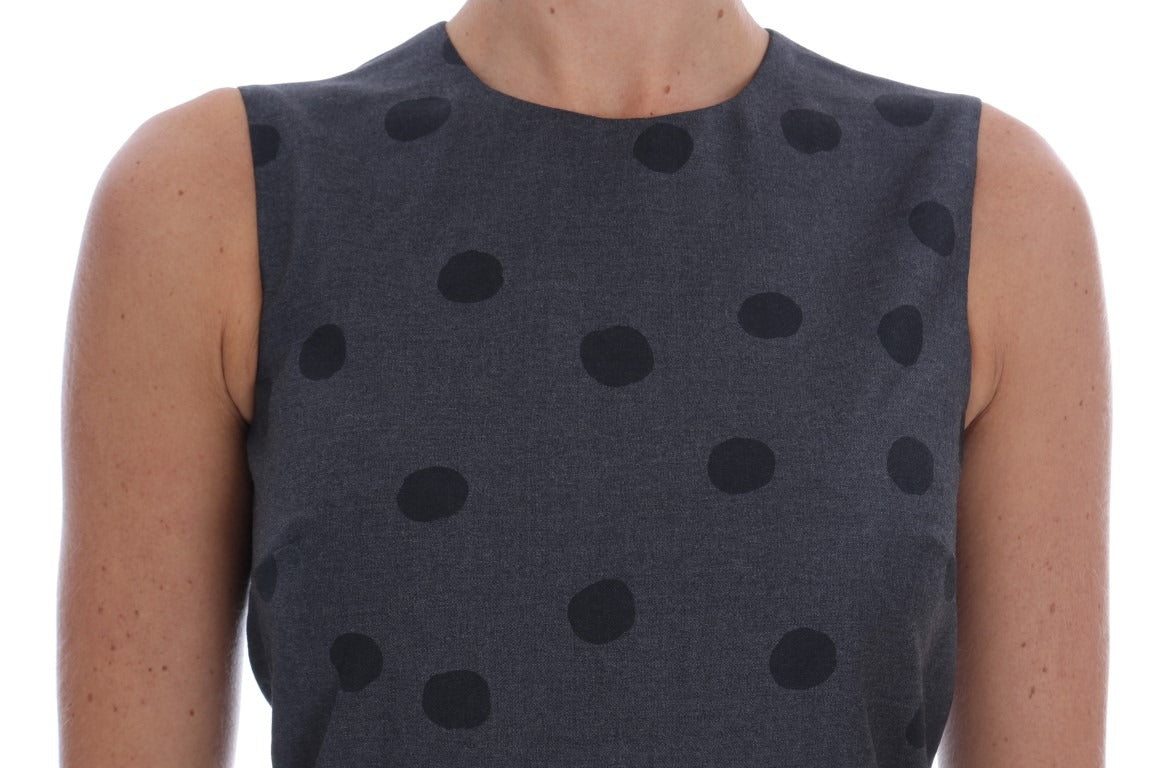 Gray polka dotted sheath wool dress by Dolce & Gabbana, fitted silhouette with long sleeves and classic round neckline.