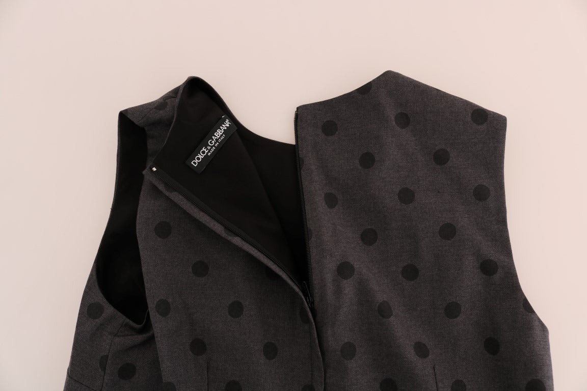 Gray polka dotted sheath wool dress by Dolce & Gabbana, close-up view showing fitted silhouette and stylish pattern.