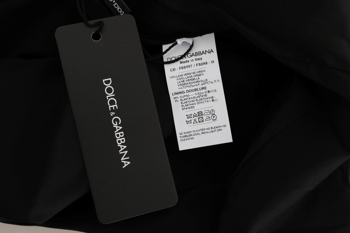 Gray polka dotted sheath wool dress by Dolce & Gabbana, close-up of fitted silhouette and textured fabric.