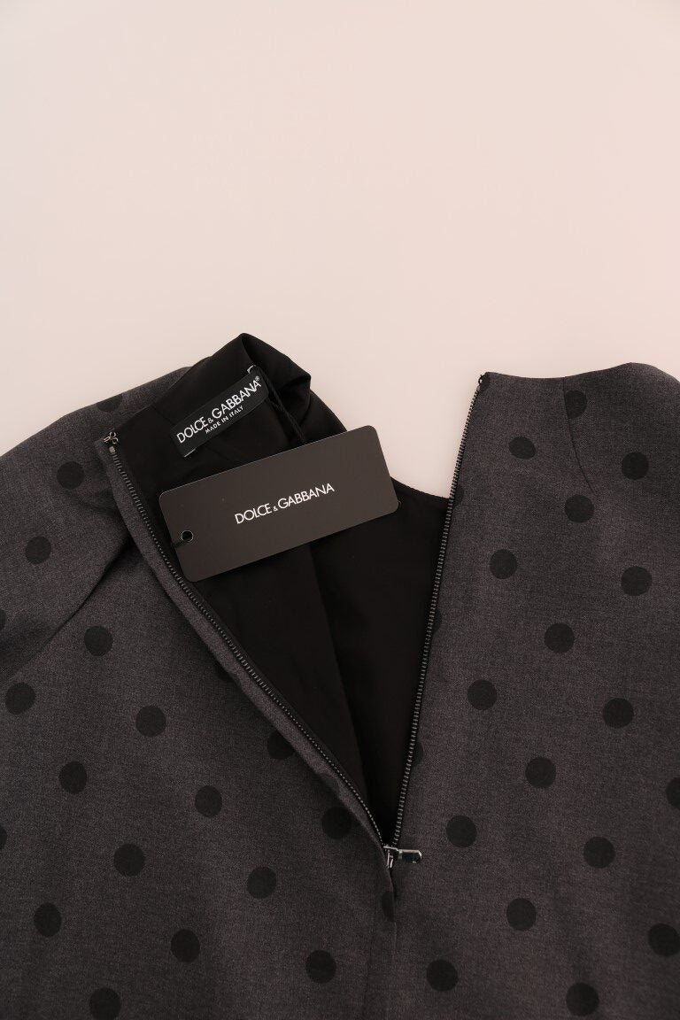 Gray polka dotted sheath wool dress by Dolce & Gabbana, close-up of the elegant fitted dress with polka dot pattern.
